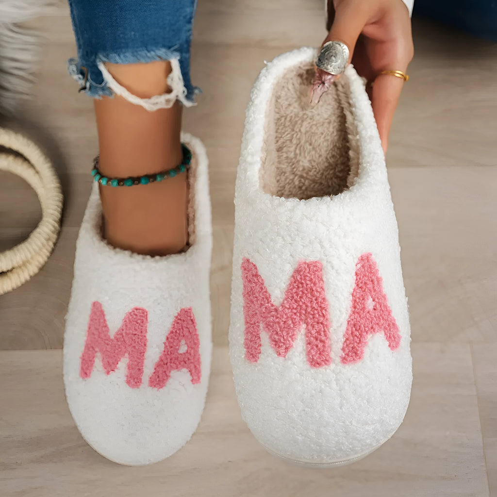 White plush cotton slippers with thick non-slip TPR sole on indoor floor
