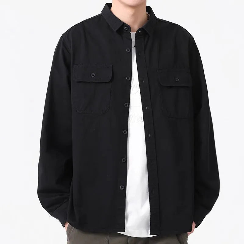 Man wearing a loose-fit light grey long sleeve cardigan-style shirt made from polyester.