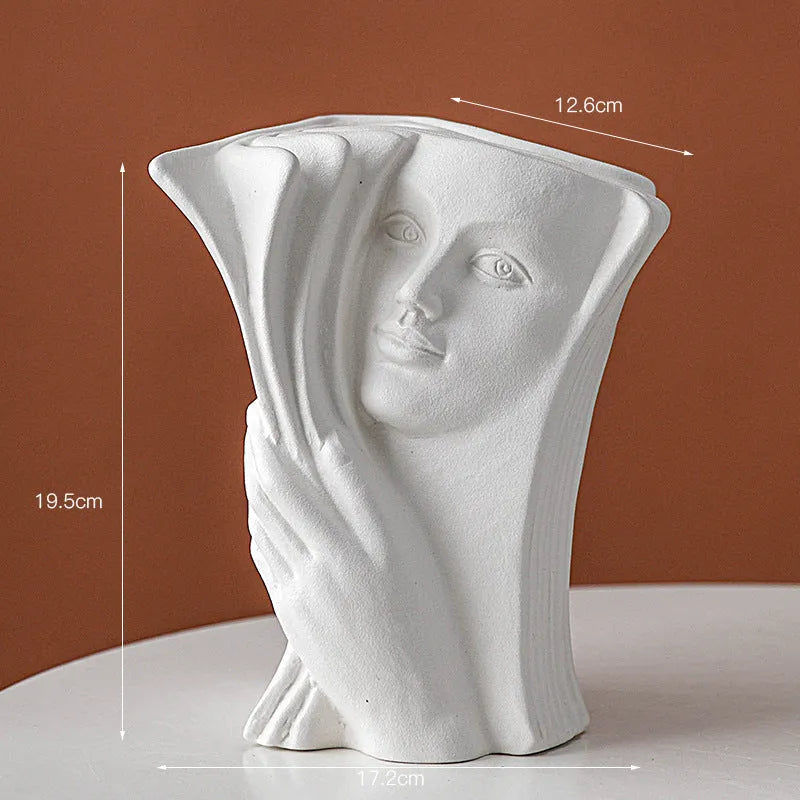 Glazed ceramic book stand ornament in one of four decorative styles on a wooden desk.