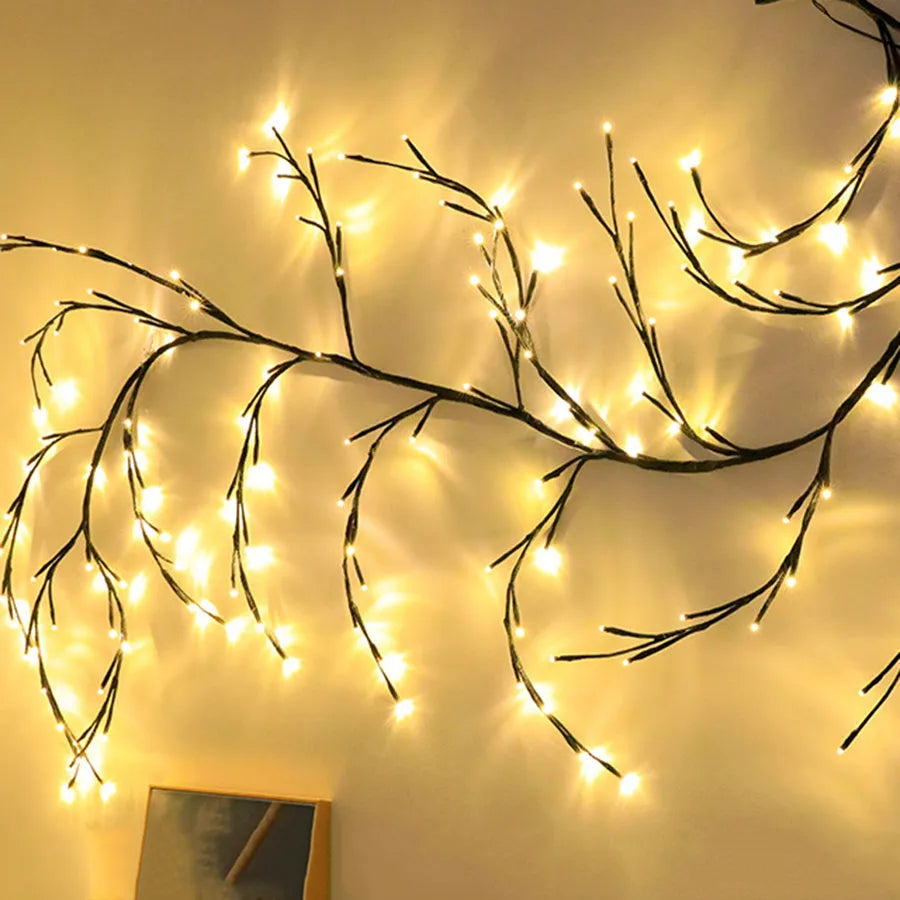 Flexible LED vine garland with warm white lights shaped on a wall for decoration