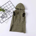 Small dog wearing a pure cotton hooded sweater in khaki with a snowflake pattern, standing on grass