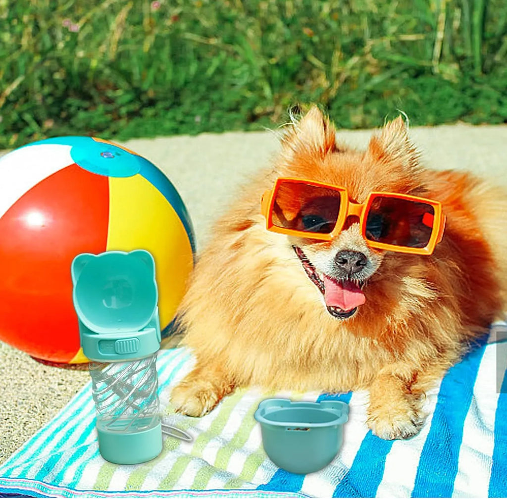 Green 3-in-1 portable pet water bottle with food container, waste bag dispenser, and carrying strap.