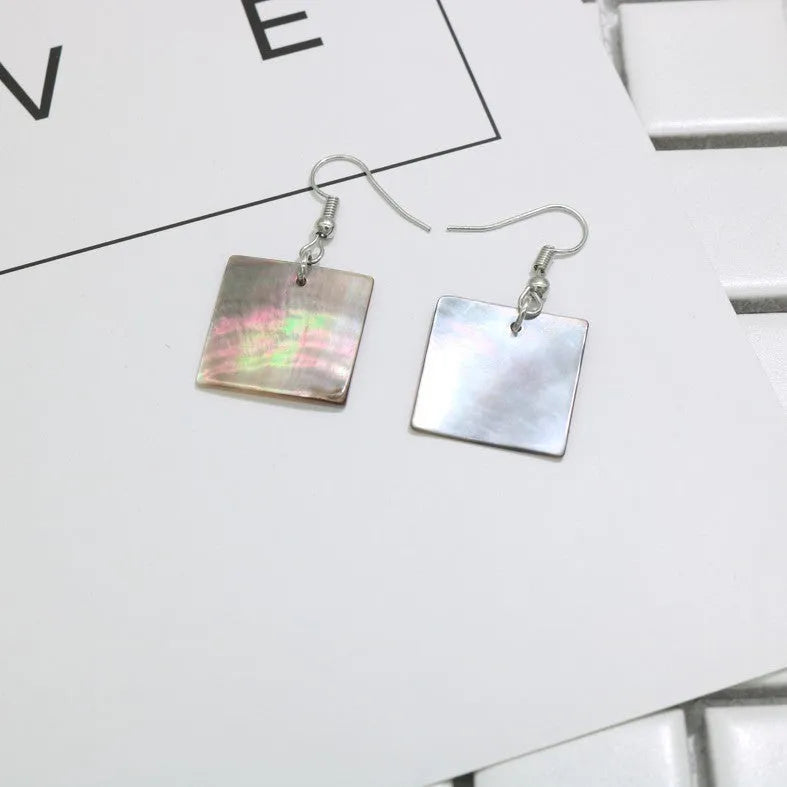 Women's natural shell earrings in geometric square and rectangular shapes with retro styling