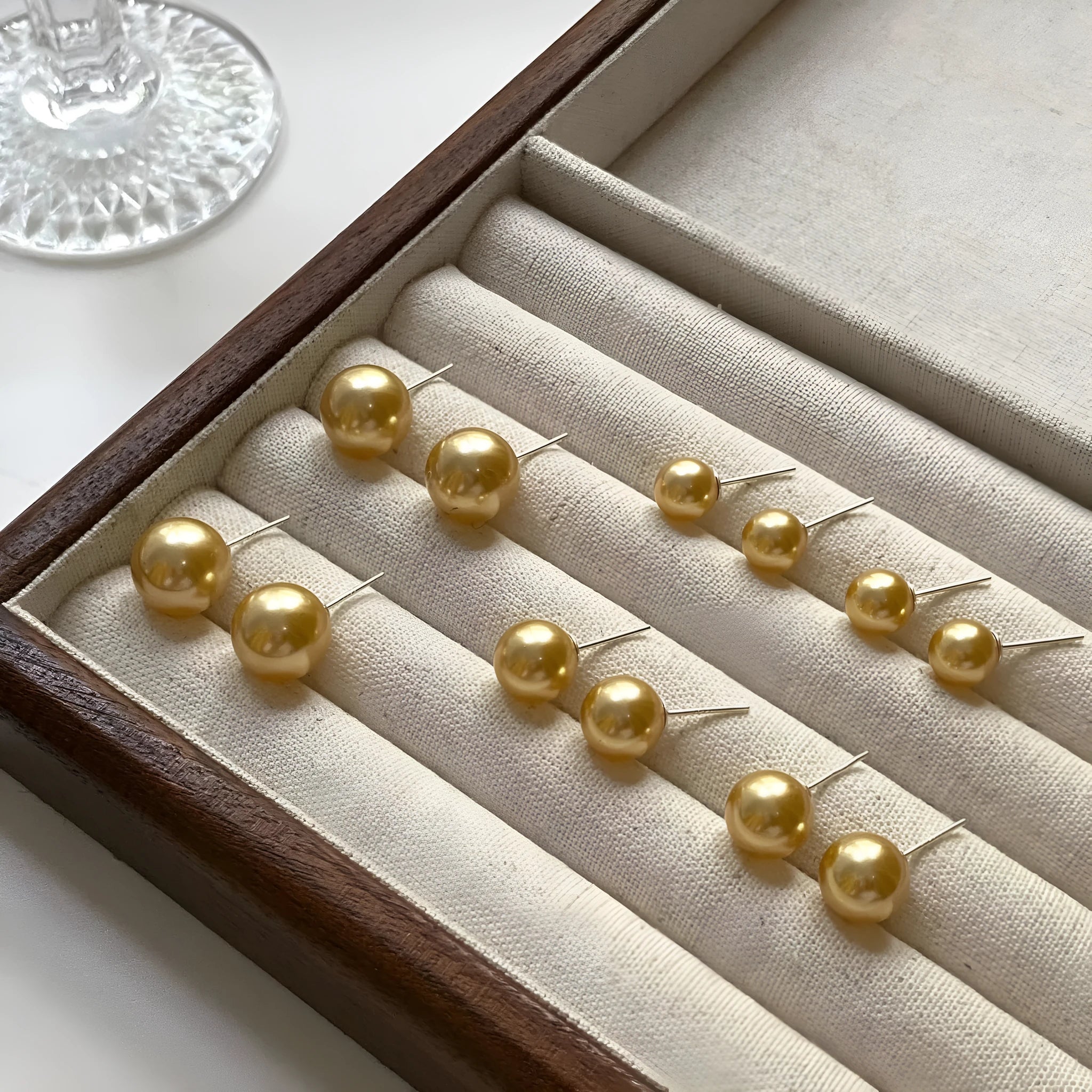 Retro geometric pearl stud earrings for women with an eight-point star design on silver setting.