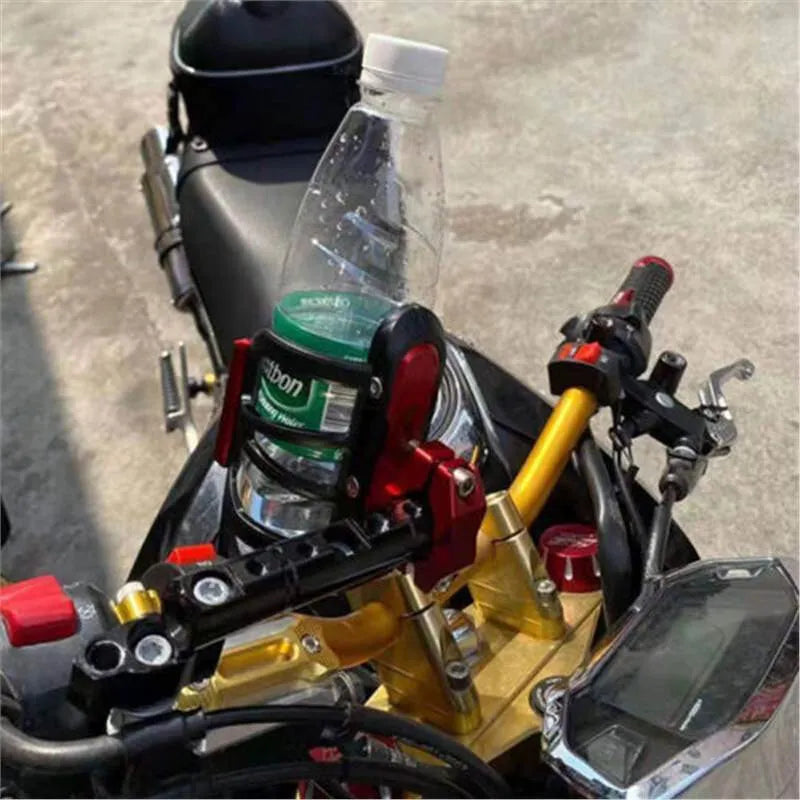 Modified black water bottle cage mounted on a Honda X-ADV scooter frame.