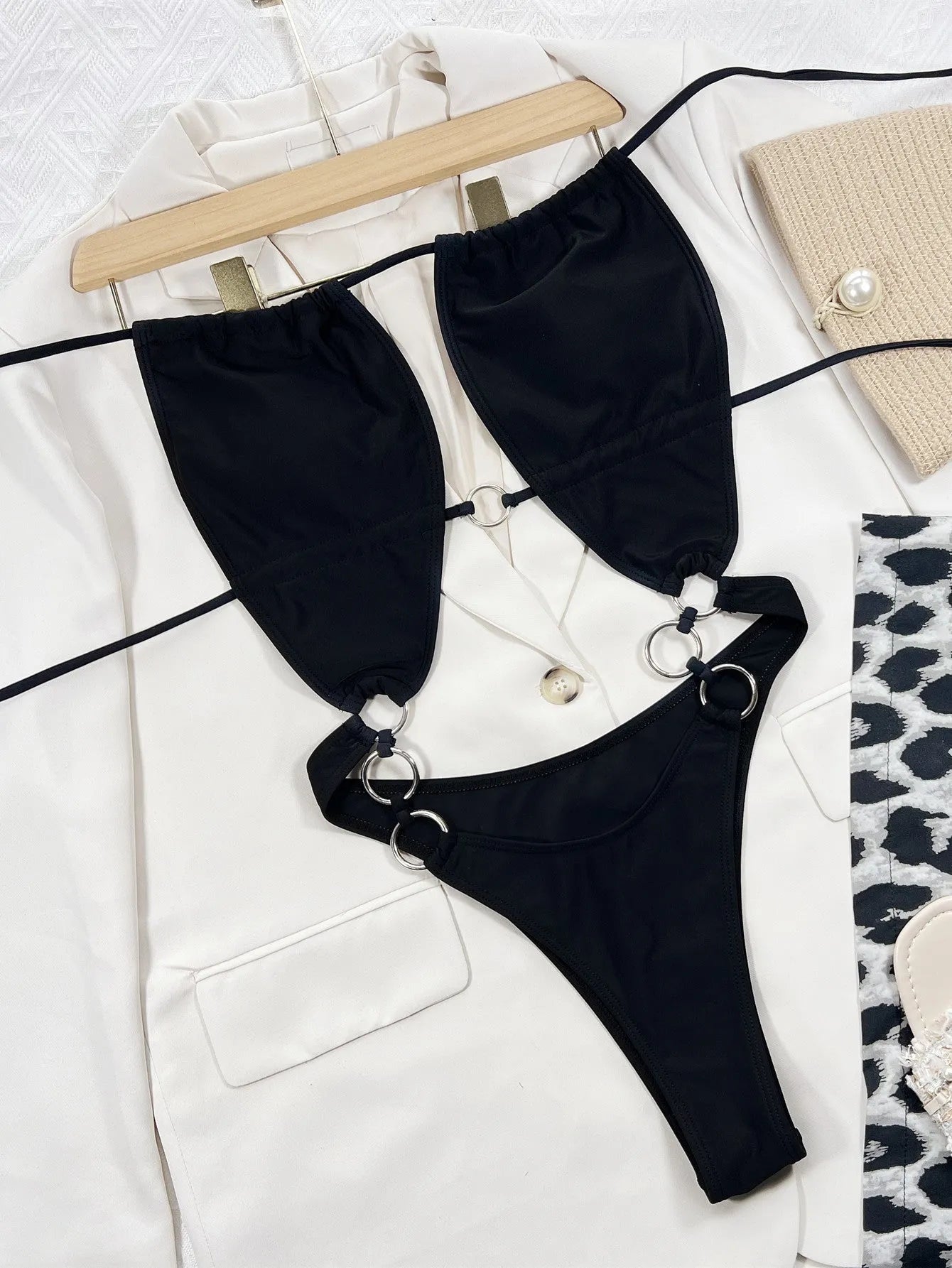 Black women's one-piece swimsuit with steel ring detail, sleeveless design