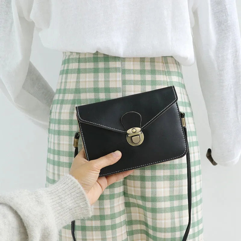 Soft retro cross square flap messenger bag in wine red, shown with lock detail and crossbody strap.