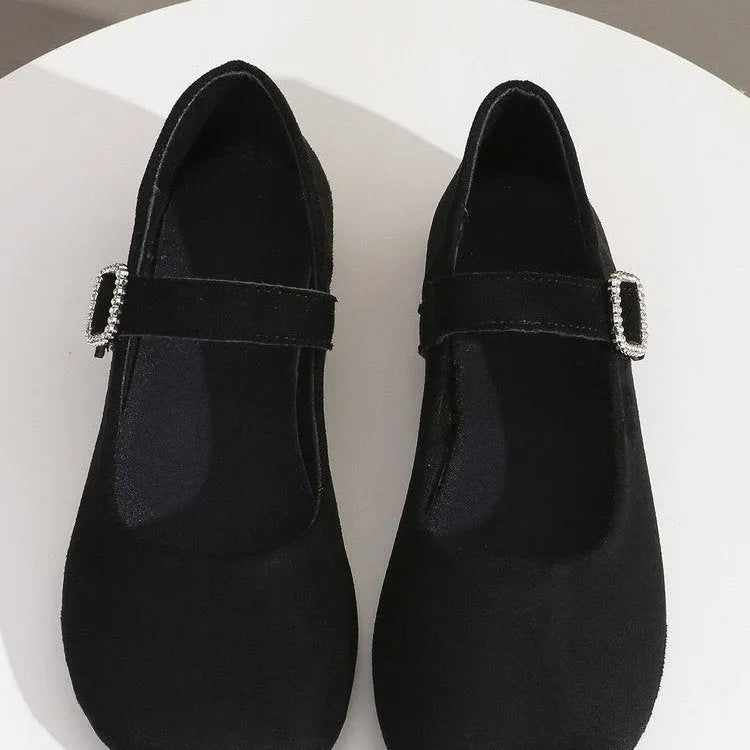 Women's solid black casual flat fisherman shoes with canvas upper and rubber sole.