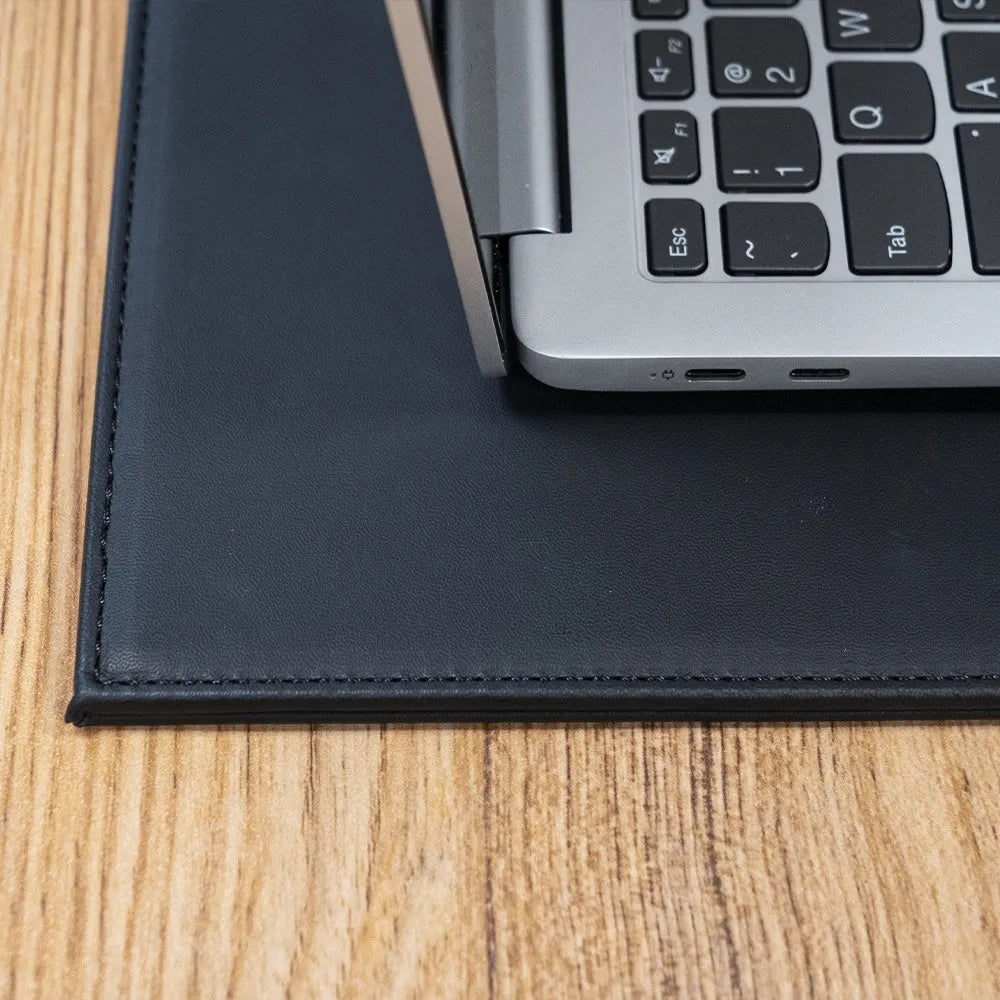 Durable tablet pad for printing in black, blue, green, and black gold colour options on a desk.