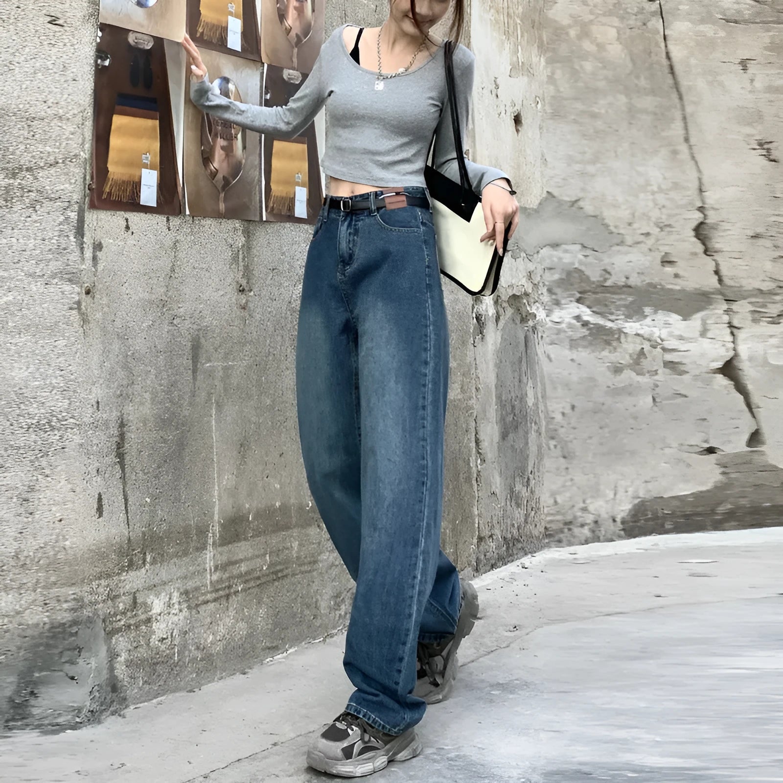 Women's retro blue straight-leg jeans with a high waist on a hanger.