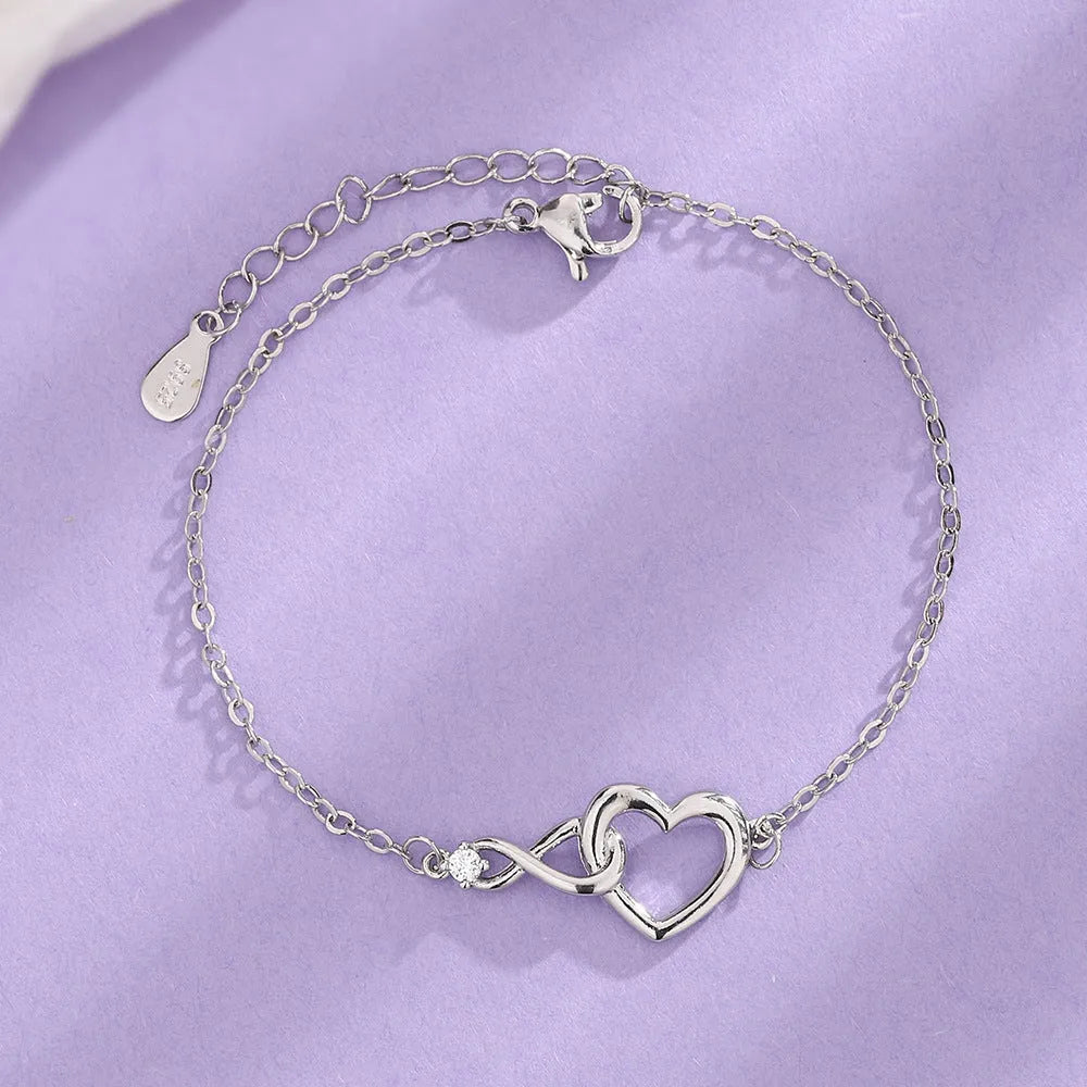 Heart-shape copper bracelet with clear 3A zirconia stone on adjustable chain in platinum finish