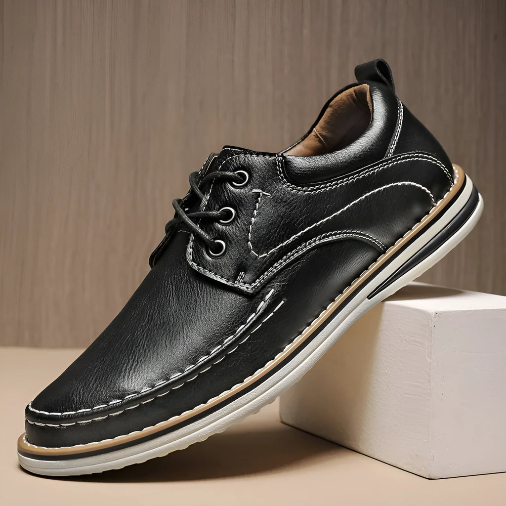 Men's black genuine leather lace-up casual shoes with round toe and rubber sole on a white background