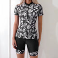 Women's floral printed swimsuit with front zipper and matching swim shorts in black or navy blue