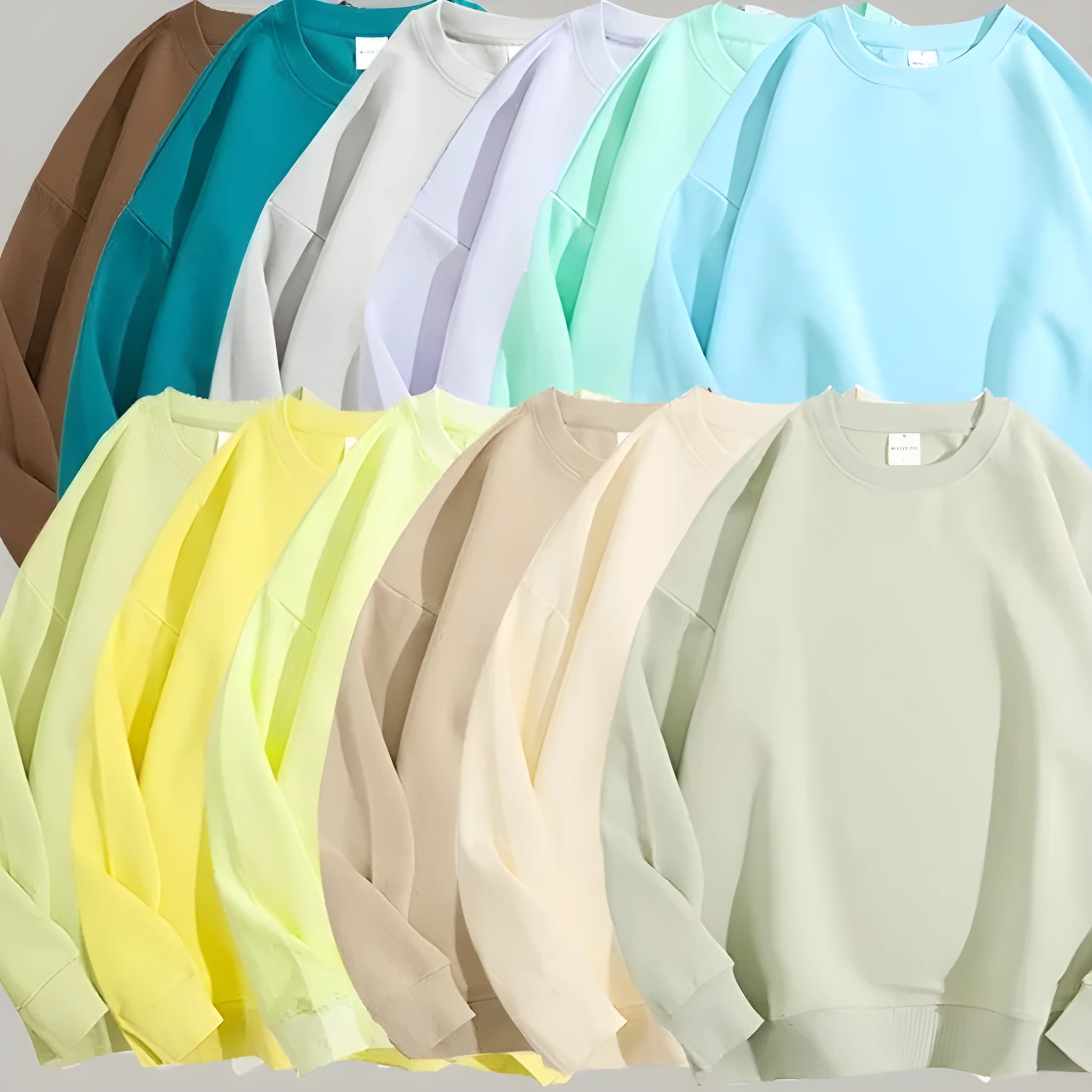 A woman's loose cotton off-shoulder sweater in a solid colour with long sleeves.