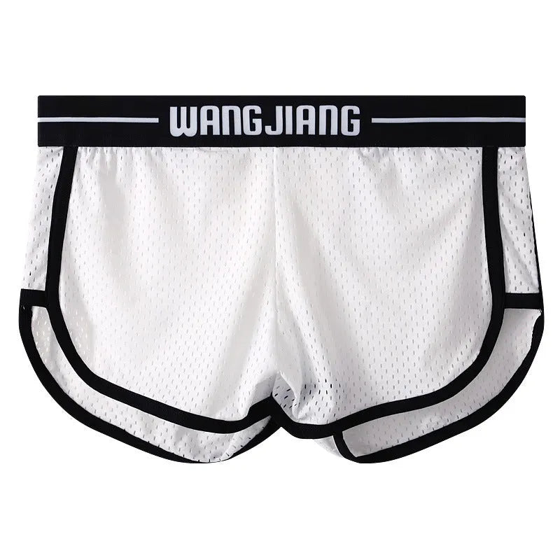 Men's solid colour Ice Silk nylon boxer shorts with a loose fit on a white background
