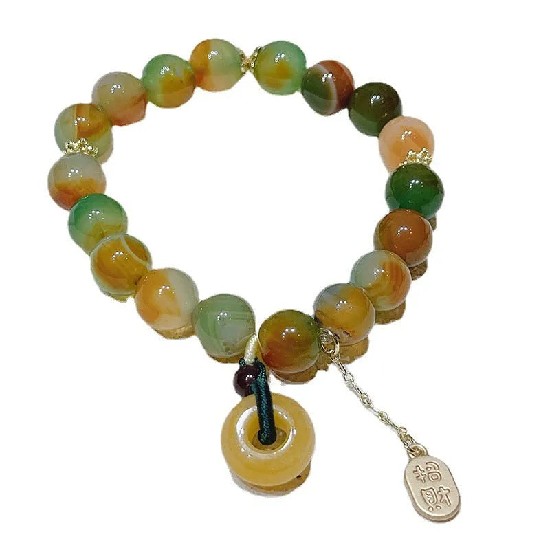 Women's peacock agate and topaz bracelet with a traditional peace buckle clasp.