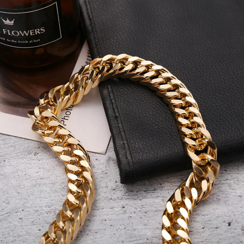 Gold thick chain women's necklace with large links, shown from the side on a plain background.