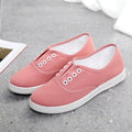 Low-top canvas casual shoes in black, featuring a flat heel and plastic sole.