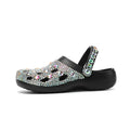Black platform sandals with rhinestone decoration and hole design across EVA upper