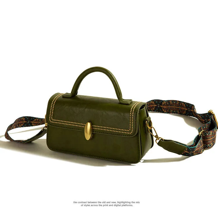 Brown retro women's messenger bag made of PU leather showing sewing thread detail and sandwich pocket.