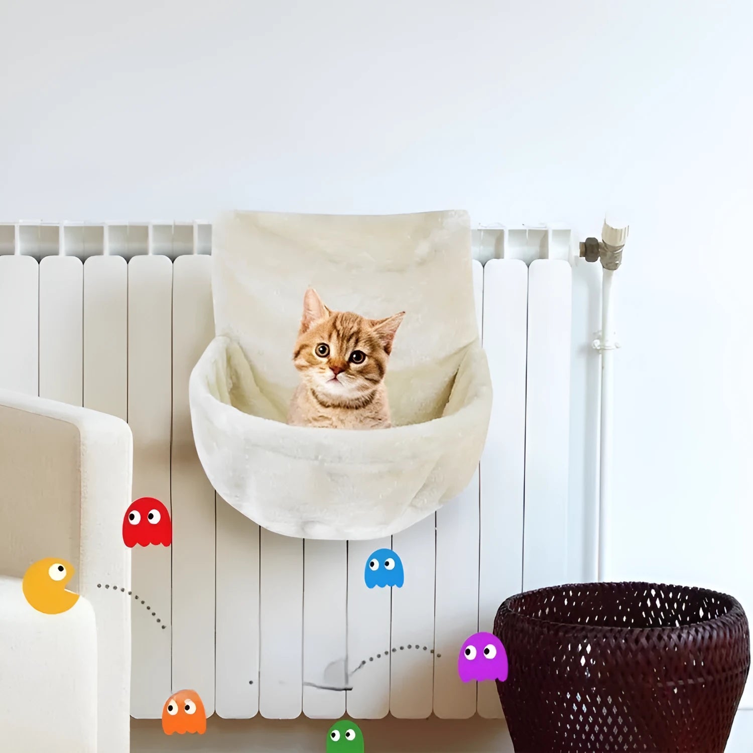 Iron frame cat hammock with grey fleece fabric suspended on a metal frame.
