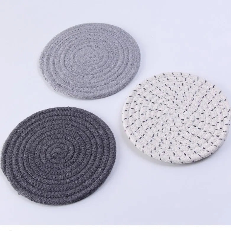 Three round cotton cord coasters in blue colour with modern simplicity design