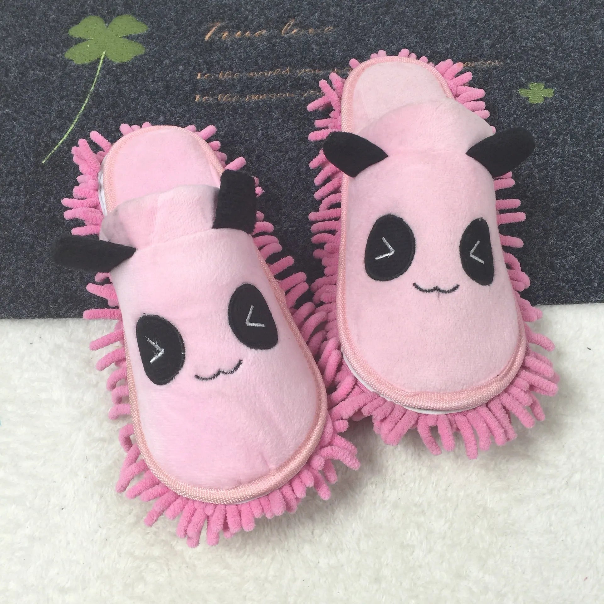 Brown animal print slippers with a removable panda face design on a coral fleece upper.