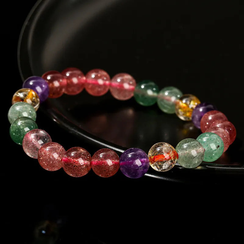A women's bracelet with pink strawberry quartz and natural tourmaline beads in geometric shapes, showing 7mm, 8mm, and 9mm size options.