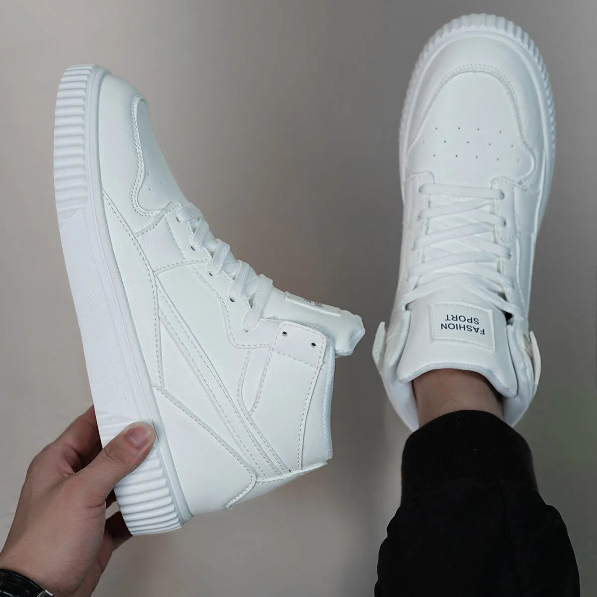 Men's white casual shoes with round toe and microfiber upper on a plain background.