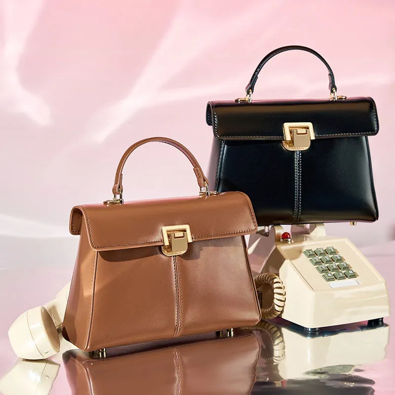 Black genuine leather women's shoulder bag with a front clasp, shown with a detailed view of the internal zip pocket.