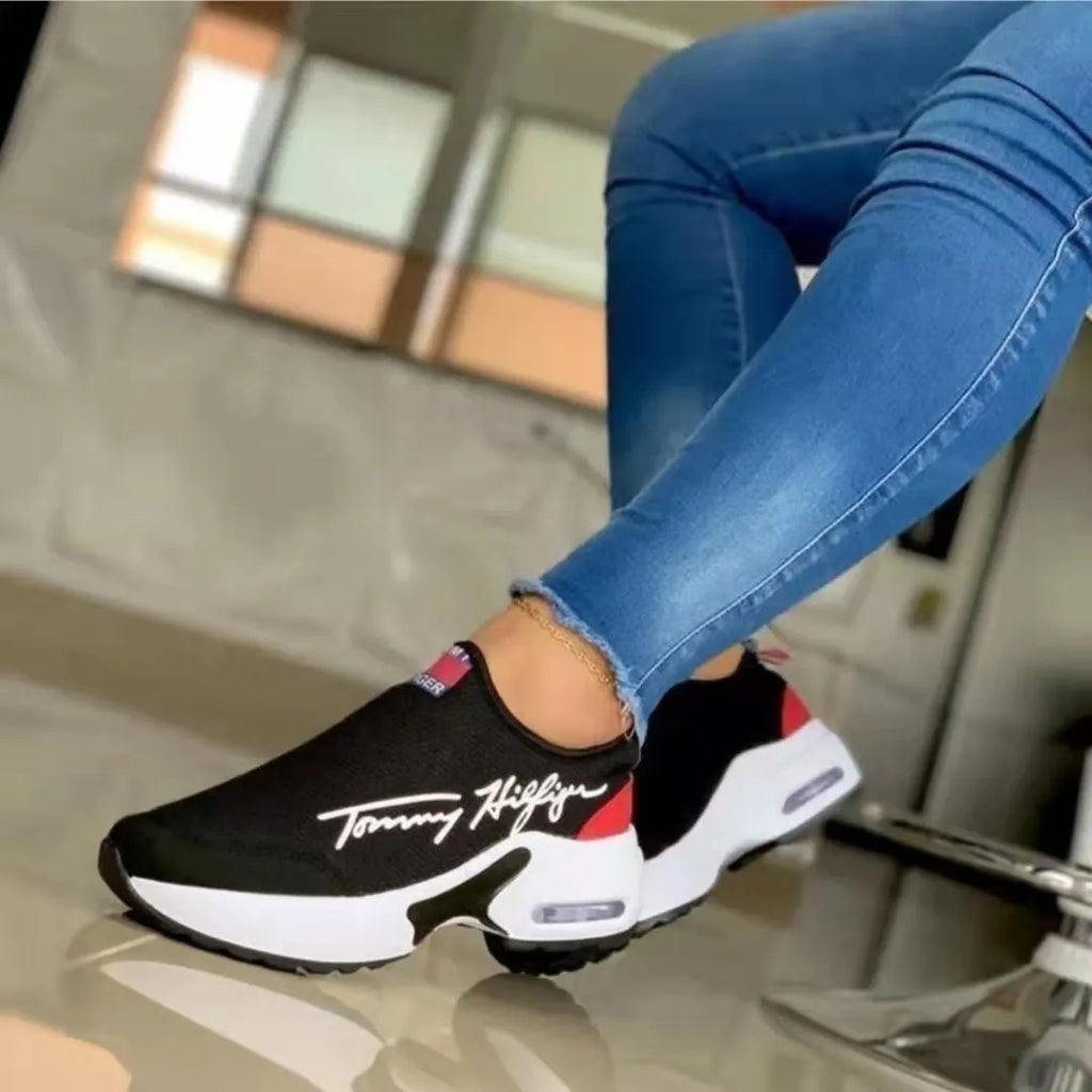 Air cushion slip-on sneakers for women with breathable mesh upper and wedge heel in black
