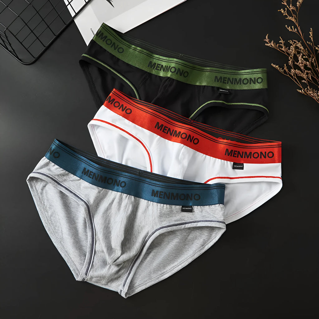 Men's low waist cotton briefs in a solid colour with contrast trim, shown in one of nine available colour combinations.