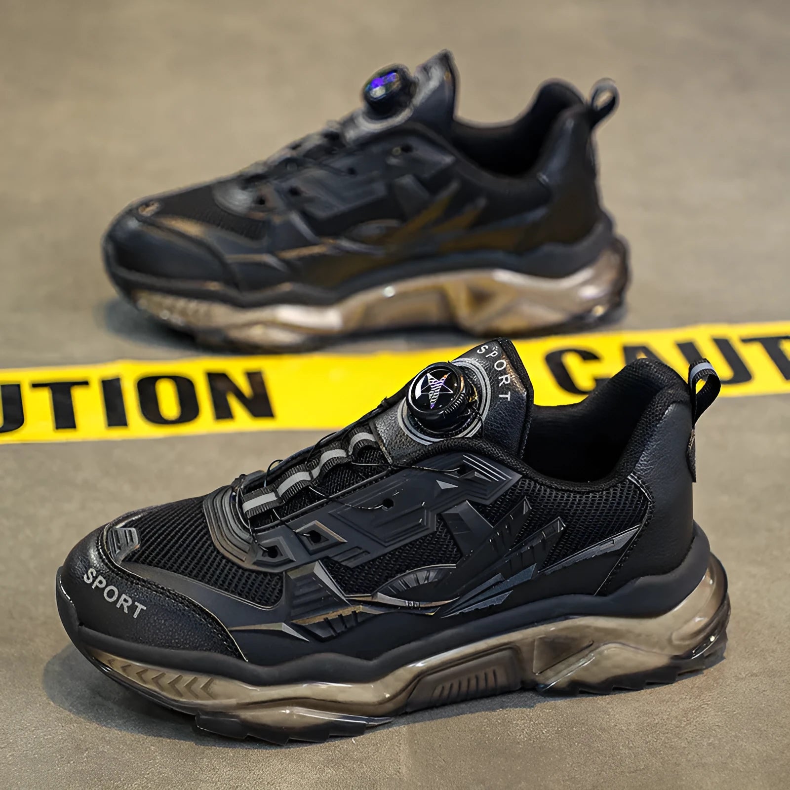 Men's black rotating button dad sneakers with mesh upper and platform sole on a white background.