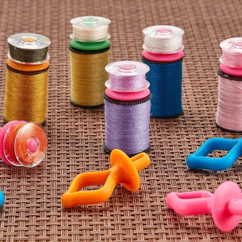 20 silicone bobbin core clips in random colours for sewing machine bobbin storage and anti-shedding thread management.