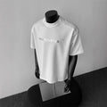 Men's white cotton short sleeve pullover t-shirt with black letters pattern, loose fit