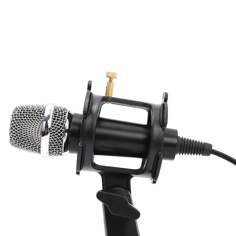 Black condenser microphone on aluminium stand with 3.5mm and USB cables for mobile and computer broadcasting