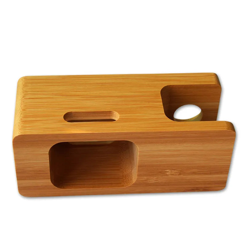 Bamboo desk stand holding a watch and smartphone on an office desk