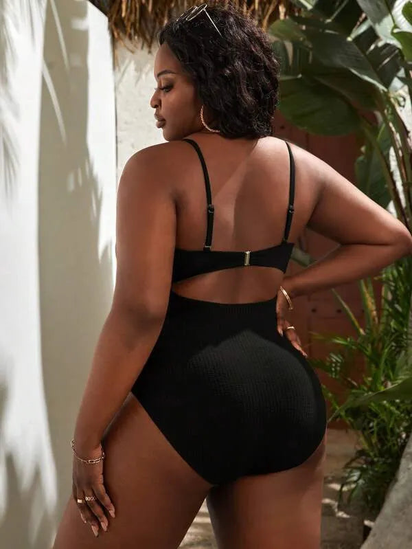 Black plus size women's slimming one-piece swimsuit with sleeveless triangle style design