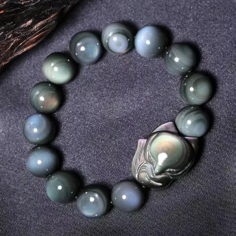 Obsidian stone bracelet with carved fox design in cartoon style, showing bead size options.