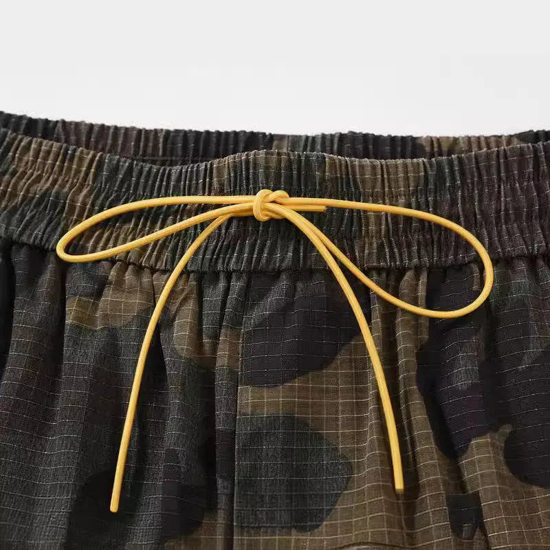 Men's green washed camouflage cotton workwear shorts with loose fit and mid waist design