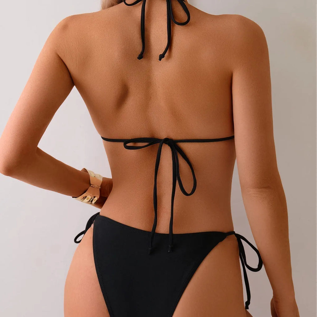 Black women's two-piece bikini swimsuit with metal bead decoration on the top.