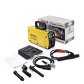 MMA-200MIN compact inverter DC welding machine with welding tongs, grounding clamp, and face shield on a workbench.