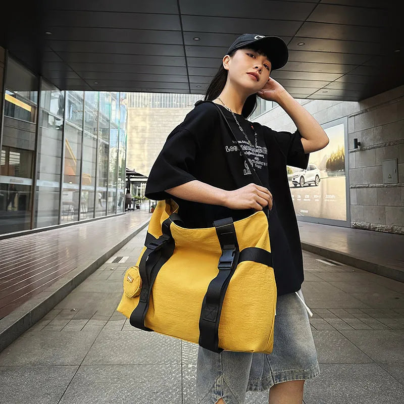 Men's large capacity shoulder travel bag in black colour with organisational compartments