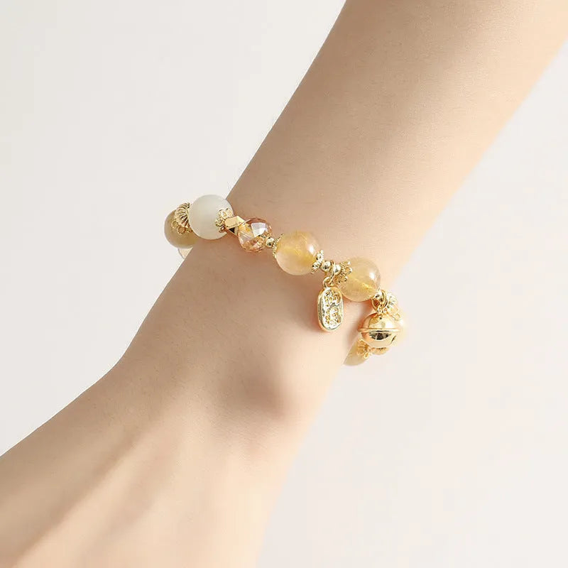 Gold tone rutilated quartz crystal bracelet with electroplated finish and Korean style design