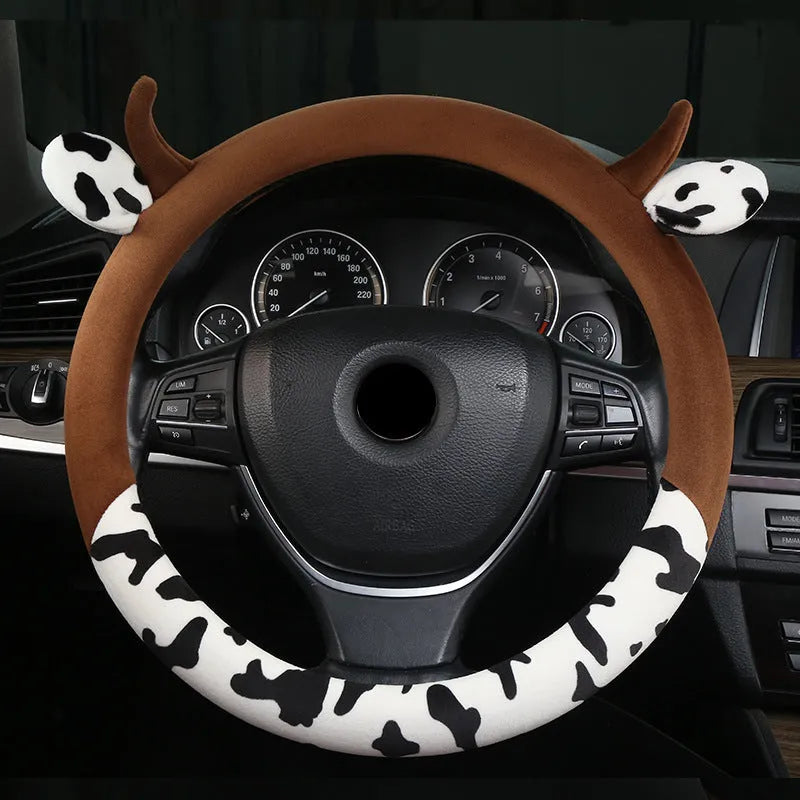 Black plush steering wheel cover with protective handle on car steering wheel