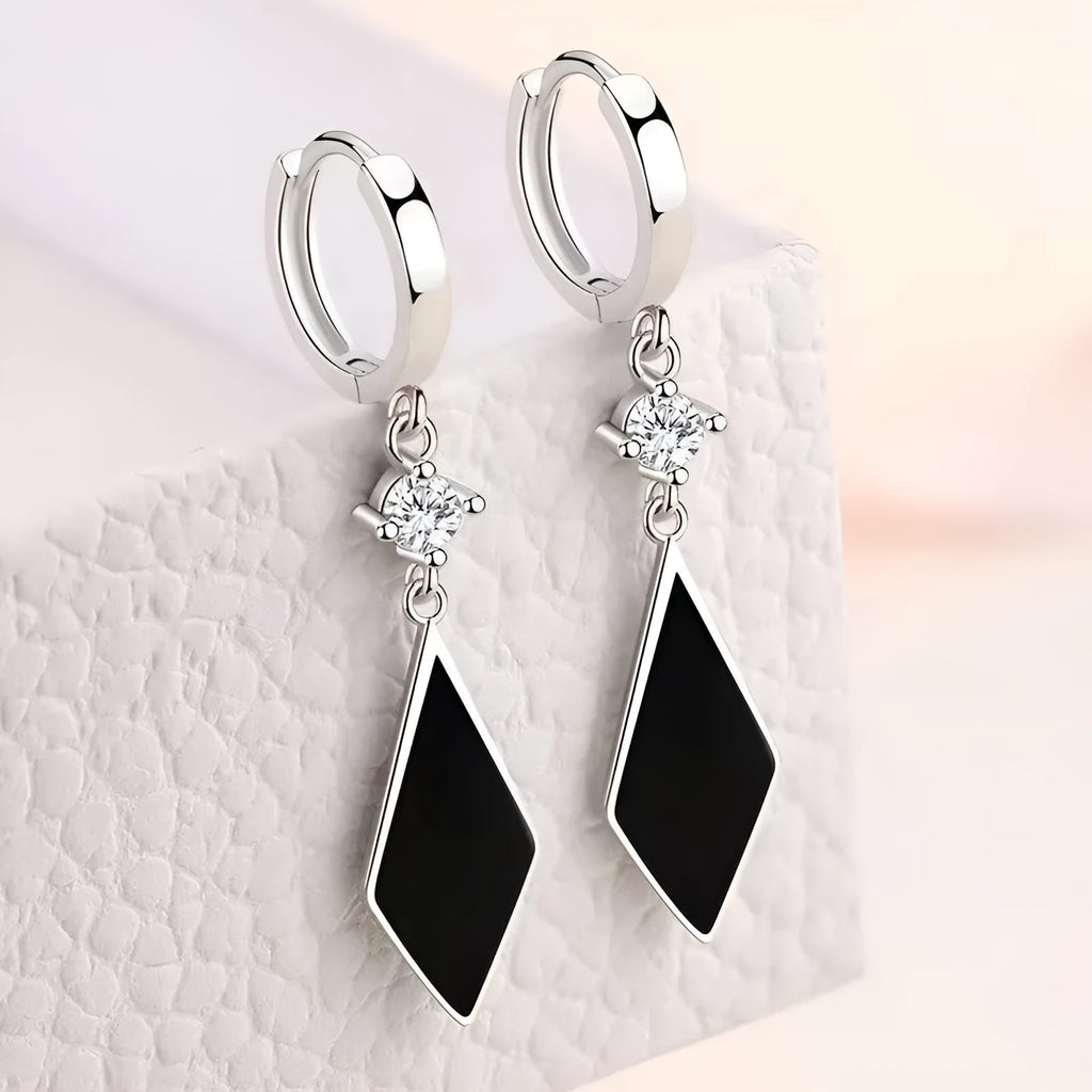 Geometric diamond silver ear clip earrings with angular design on zinc alloy base