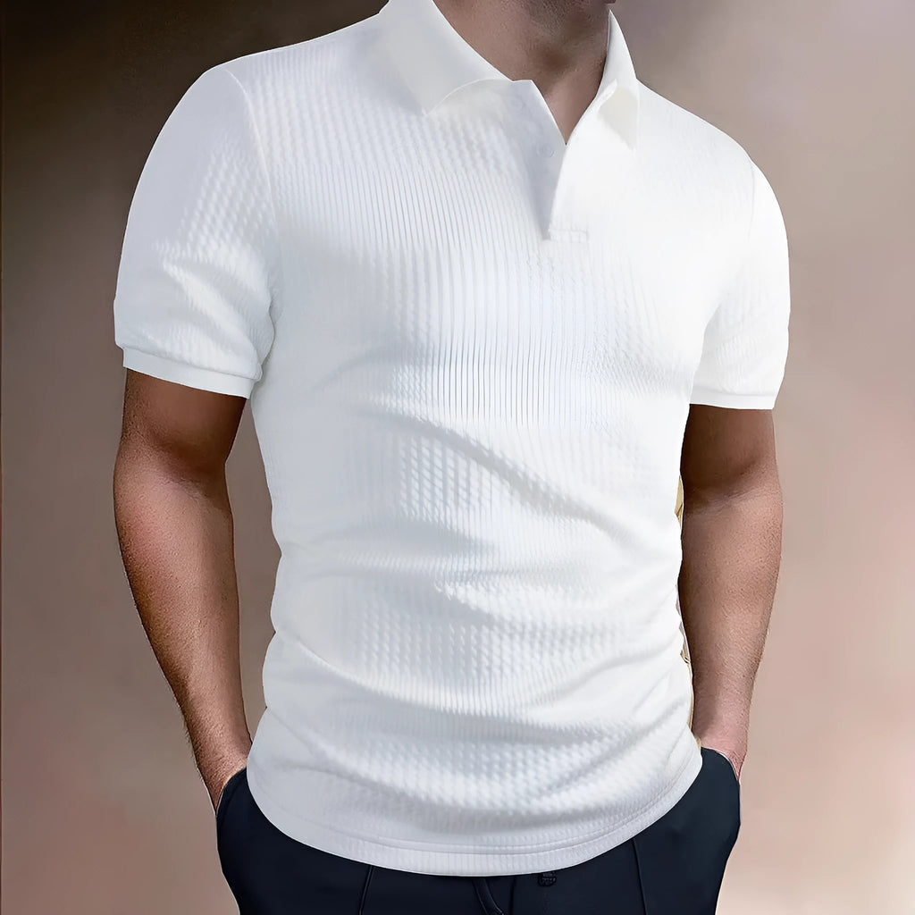 Man wearing a loose-fit striped polo shirt in a light blue colour, showing asymmetric detail and short sleeves.