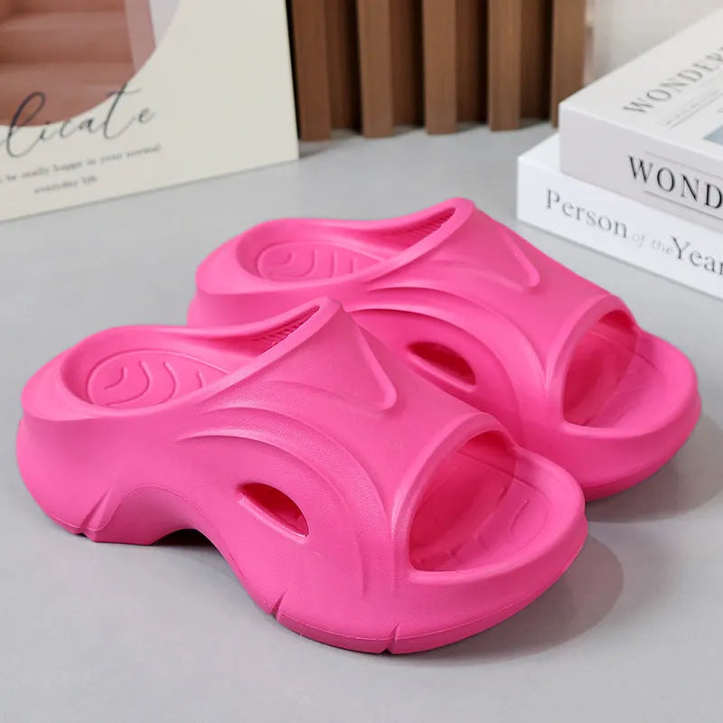 Women's thick-soled EVA slippers in white, black, or rose red colours with rounded toe design