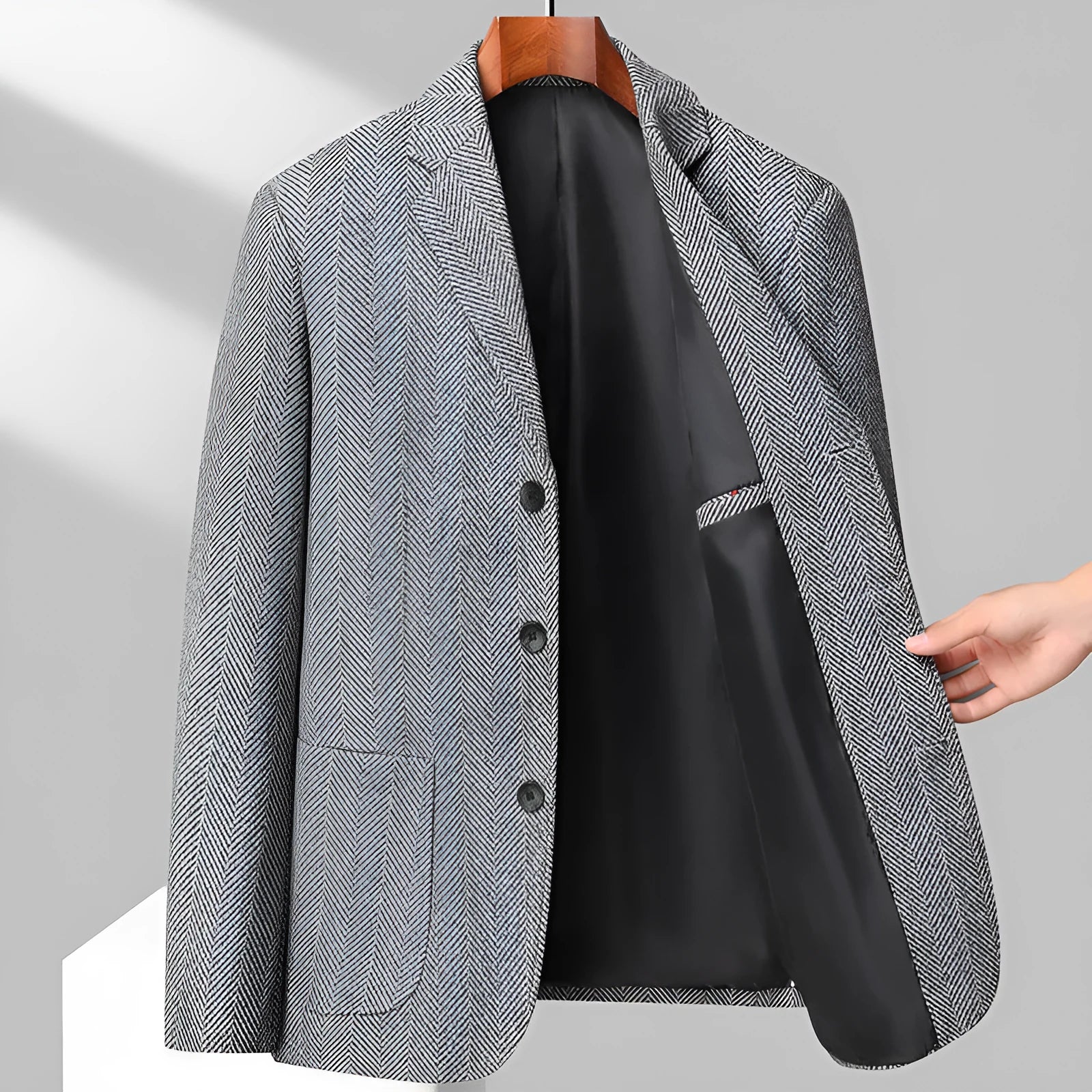 Men's loose-fit woolen suit coat in a solid colour, shown for casual spring or autumn wear.