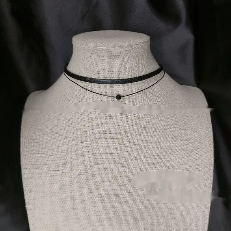 Retro leather rope double layer necklace with glass crystal beads and stainless steel buckle on a neutral background